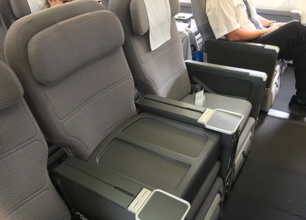 With the middle seat of three blocked off, these international premium economy seats become domestic business
